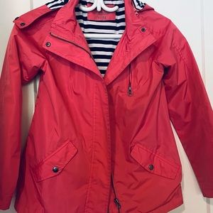 Girl rain coat pinkish in color girl 10 -12 fits